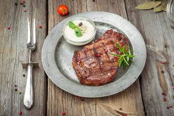 Tenderloin steak on plate with sauce