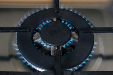 Gas burner flame at gas stove, close-up.