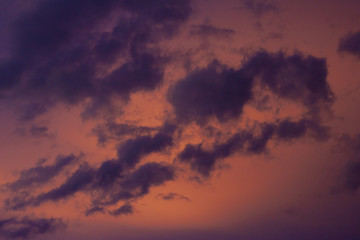 Naklejka na ściany i meble Gold sky on evening, Dark cloud before rainy and orange light from golden sunset. 