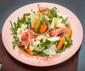Fresh salad from vegetables, cheese and ham
