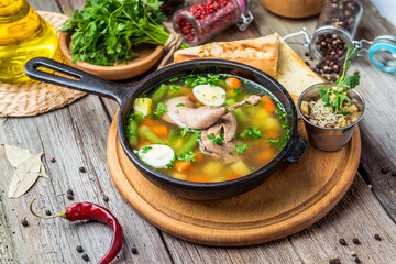 Soup with quail meat, with quail eggs and vegetables