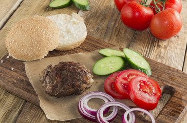 Delicious burgers with beef, tomato, cheese and lettuce