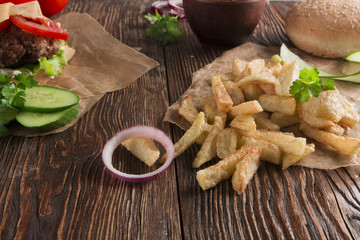 Delicious burgers with beef, tomato, cheese and lettuce