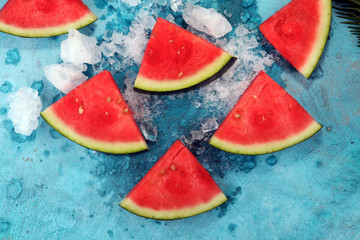 watermelon on blue background. juicy summer fruit in slices