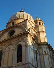 Fototapeta na wymiar Afternoon sunlight illuminates the Chiesa di Santa Maria dei Miracoli, Venice, Italy