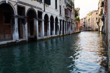 Fototapeta na wymiar Venetian portico and canal, Venice, Italy