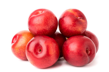 A bunch of ripe plums on a white, isolated.