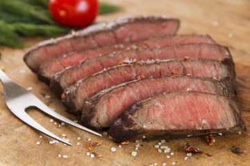 cooked beef steak sliced medium rare close-up