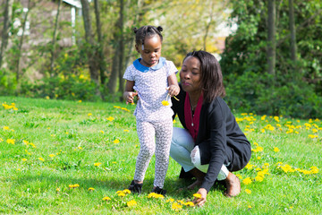 Lifestyle photography with young African family in a park setting in Canada to show different...