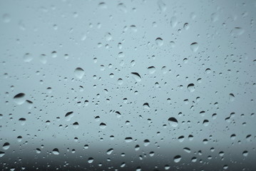 Water drops on glass. The window In rainy weather. Closeup. 