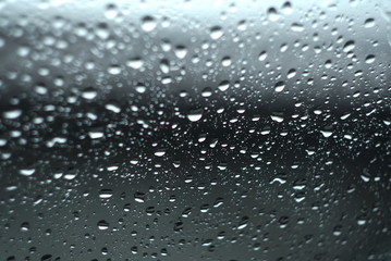 Water drops on glass. The window In rainy weather. Closeup. 