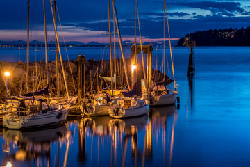 Sailboats anchored in Marina in White Rock, British Columbia in Canada at night