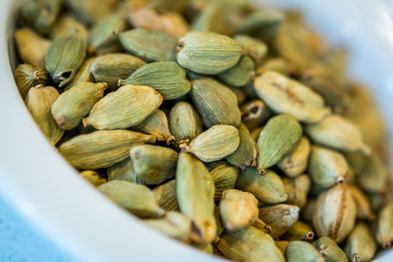 green cardamom seeds in a bowl
