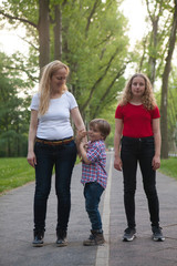 Mother and children during a trip on a road