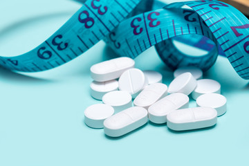 Pills spilling out of pill bottle