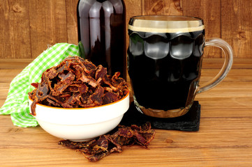 Bowl of shredded biltong meat on a wooden background