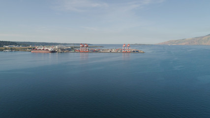 Sea cargo port with cranes, docks, containers in Subic Bay. Philippines,Luzon. Aerial view: cargo port and container terminal.
