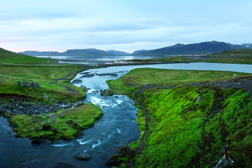Fototapeta na wymiar Typical Iceland landscape with mountains and river in summer time