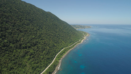Aerial view of Patapat viaduct in the coast of Pagudpud, Ilocos Norte. Highway with bridge by coast sea near the mountains. Philippines, Luzon. Highway along the coast.