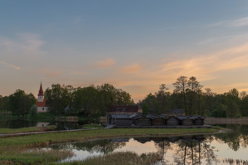 Obraz premium Sunrise view to Araisi church and Araisi lake in Vidzeme, Latvia