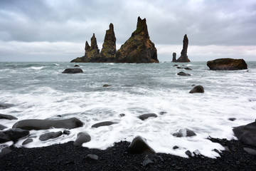 Basalt rock formations Troll toes on black beach. Reynisdrangar, Vik, Iceland