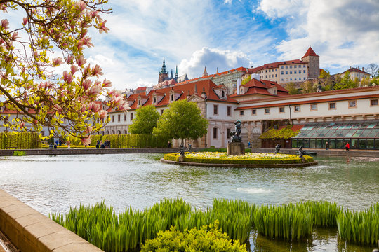 Wallenstein garden with a pond and a fountain, the most impressive in Prague. Spring time with blooming magnolia.