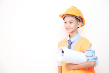 Young boy engineer isolated in white. Handsome early teenage boy portrait with engineering cloth. Holding a blue print.