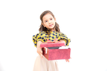 Young girl give suprise gift. Young cute white girl giving a gift present box, looking cute. Isolated in white. Birthday and family concept.