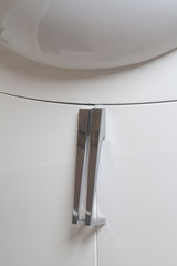 Cabinet handles under sink, in the bathroom