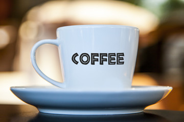 Coffee cup on a table with bokeh background