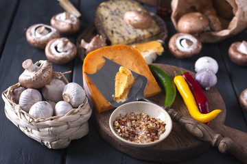 Different cheese. Dutch cheese with spices and cheese with mushrooms. Dairy. Ingredients for cooking dinner. View from above. 