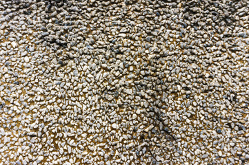 Ground stone grey background of many small stones