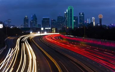 MARCH 5, 2018, DALLAS SKYLINE TEXAS, and Tom Landry Freeway, with streaked lights on Interstate 30...