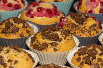 freshly baked muffins with fruit in baskets