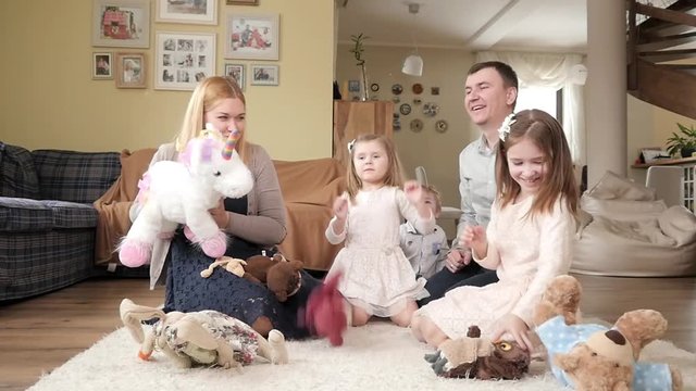 Big Happy Family with Kids play throw up Plush Toys sitting on a Home Floor