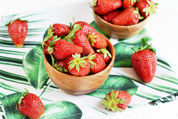 Wooden bowl of red strawberries