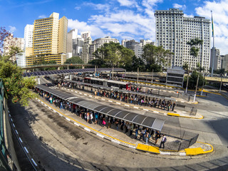Obraz premium Sao Paulo, Brazil, February 22, 2018: View of people waiting for urban buses in Bandeira Bus Terminal, Sao Paulo, Brazil
