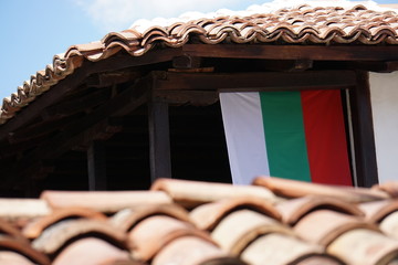 Traditional house with flag