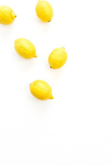 Bright lemons set on white background. Flat lay, top view.