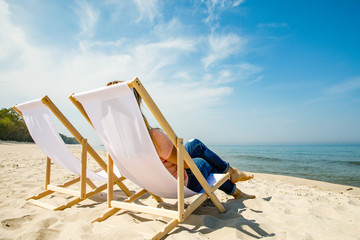 Fototapeta premium Woman relaxing on beach