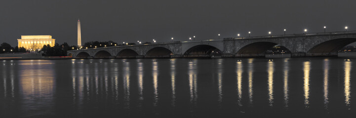 APRIL 10, 2018 - WASHINGTON D.C. - Memorial Bridge at dusk spans Potomac River and features Lincoln...