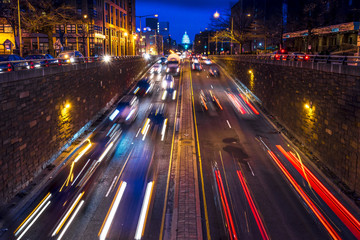 Rush hour traffic on North Capitol show tail lights leading to US Capitol, Washington D.C.