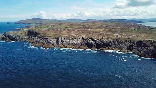 aerial footage of beautiful landscape with cliffs and ocean in northern point of Ireland, Malin Head  