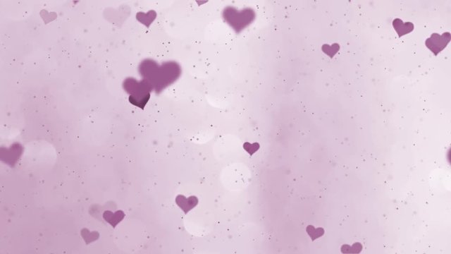 Shiny violet colored hearts motin on blurry silver pink bokeh reflection background. 