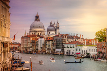 Naklejka premium Canal Grande with the iconic dome of the Basilica of St. Mary of Health