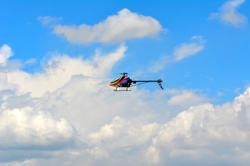 Fototapeta na wymiar Homemade radio control helicopter on blue sky.