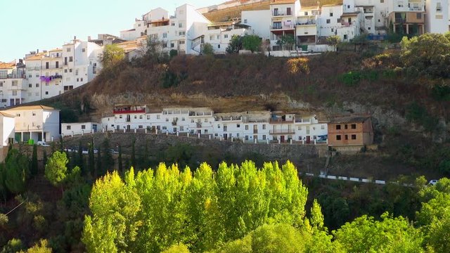 White Apartment Buildings Against a Hillside