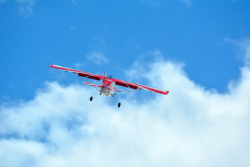 Homemade radio control aircraft on blue sky.