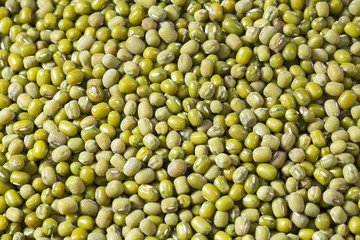 Raw mung beans. Wood background - Vigna radiata