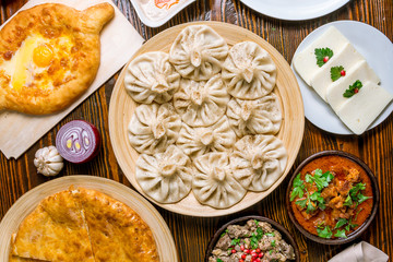 Georgian cuisine foodset from khachapuri, khinkali, pkhali, dolma, satsivi top view